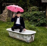 Retired gentleman with pink umbrella in a tub. Original image from <a href="https://www.rawpixel.com/search/carol%20m.%20highsmith?sort=curated&amp;page=1">Carol M. Highsmith</a>&rsquo;s America, Library of Congress collection. Digitally enhanced by rawpixel.