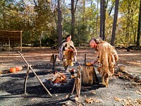 Historic interpreters prepare a meal in the re-created Powhatan Indian Village at the Jamestown Settlement living-history museum in Jamestown, Virginia. Original image from <a href="https://www.rawpixel.com/search/carol%20m.%20highsmith?sort=curated&amp;page=1">Carol M. Highsmith</a>&rsquo;s America, Library of Congress collection. Digitally enhanced by rawpixel.