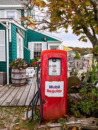 Old gas pump in the garden of the Chowder House Boat Bar in Boothbay Harbor, Maine. Original image from <a href="https://www.rawpixel.com/search/carol%20m.%20highsmith?sort=curated&amp;page=1">Carol M. Highsmith</a>&rsquo;s America, Library of Congress collection. Digitally enhanced by rawpixel.