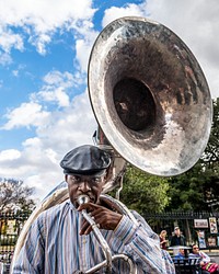 A Sousaphone player performs with his brass band in New Orleans's Jackson Square.