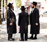 Three Hasidic Jews in a traditional long black jackets on a street in the Boro Park in  Brooklyn, New York City. Original image from <a href="https://www.rawpixel.com/search/carol%20m.%20highsmith?sort=curated&amp;page=1">Carol M. Highsmith</a>&rsquo;s America, Library of Congress collection. Digitally enhanced by rawpixel.