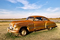 Vintage car on a field. Original image from Carol M. Highsmith’s America, Library of Congress collection. Digitally enhanced by rawpixel.