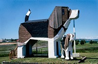 Dog Bark Park Bed & Breakfast, Cottonwood, Idaho (2004) photography in high resolution by John Margolies. Original from the Library of Congress. Digitally enhanced by rawpixel.