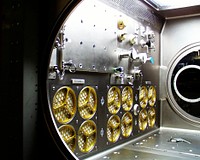 Interior lights give the Microgravity Science Glovebox (MSG) the appearance of a high-tech juke box. Original from NASA. Digitally enhanced by rawpixel.