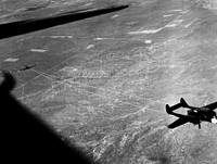 NACA photographer Northrop P-61A Black Widow towing P-51B to release altitude of 28,000 ft over Muroc Dry Lake, California for in flight validating of wind tunnel measurements of drag. Original from NASA. Digitally enhanced by rawpixel.
