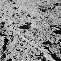 Two moon-exploring crew men of the Apollo 14 lunar landing mission, photographed and collected the large rock pictured just above the exact center of this picture. Original from NASA. Digitally enhanced by rawpixel.