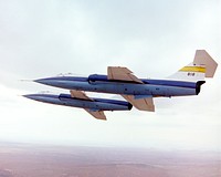 F-104A 818 flown by Einar Enevoldson and F-104A 820 flown by Gary Krier in formation over the Mojave Desert. Original from NASA . Digitally enhanced by rawpixel.