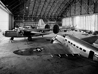 Aircraft in the Flight Research Building at the Aircraft Engine Research Laboratory: A Consolidated B&ndash;24D Liberator (left), Boeing B&ndash;29 Superfortress (background), and Lockheed RA&ndash;29 Hudson (foreground) parked inside the Flight Research Building at the National Advisory Committee for Aeronautics (NACA) Aircraft Engine Research Laboratory in Cleveland, Ohio. June 20th,1944.