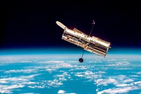 The Hubble Space Telescope hovers at the boundary of Earth and space. Original from NASA. Digitally enhanced by rawpixel.