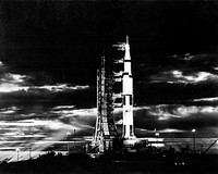 Searchlights illuminate this nighttime scene at Pad A, Launch Complex 39, Kennedy Space Center, Florida, showing the Apollo 17. Original from NASA . Digitally enhanced by rawpixel.
