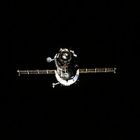 Russia&#39;s Soyuz spacecraft is backdropped against the darkness of space. Original from NASA. Digitally enhanced by rawpixel.