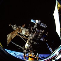 The docked Russian Mir Space Station is partially visible through the Spacehab viewing port. Original from NASA. Digitally enhanced by rawpixel.