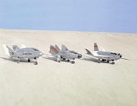 The wingless, lifting body aircraft sitting on Rogers Dry Lake at what is now NASA&#39;s Dryden Flight Research Center, Edwards, California, from left to right are the X-24A, M2-F3 and the HL-10. Original from NASA. Digitally enhanced by rawpixel.