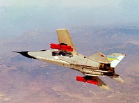 The General Dynamics TACT/F-111A (Serial #63-9778) banks over the Mojave Desert, January 29th,1976. Original from NASA . Digitally enhanced by rawpixel.