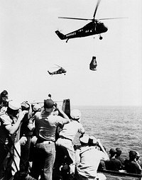 Crew members of the U.S. Navy Carrier Champlain cheer and take pictures of the arrival of the first Project Mercury pilot. Original from NASA. Digitally enhanced by rawpixel.