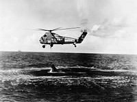 U.S. Marine Corps helicopter attempts an unsuccessful recovery of the Mercury-Redstone 4 Liberty Bell 7, July 21, 1961. Original from NASA. Digitally enhanced by rawpixel.