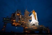 Atlantis is seen shortly after the rotating service structure was rolled back at launch pad 39a at the NASA Kennedy Space Center in Cape Canaveral, Fla. Original from NASA . Digitally enhanced by rawpixel.