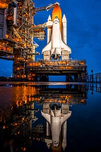 Atlantis is seen shortly after the rotating service structure was rolled back at launch pad 39a at the NASA Kennedy Space Center in Cape Canaveral, Fla. Original from NASA . Digitally enhanced by rawpixel.