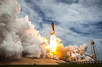 Atlantis is seen as it launches from pad 39A on Friday, July 8, 2011, at NASA&#39;s Kennedy Space Center in Cape Canaveral, Fla. Original from NASA . Digitally enhanced by rawpixel.