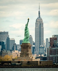 Space shuttle Enterprise, mounted atop a NASA 747 Shuttle Carrier Aircraft seen behind the Statue of Liberty, Friday, April 27, 2012, in New York. Original from NASA . Digitally enhanced by rawpixel.