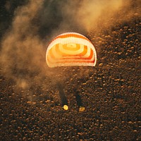 The Soyuz TMA-20M spacecraft is seen as it lands with Expedition 48 crew members near the town of Zhezkazgan, Kazakhstan, Sept. 7, 2016. Original from NASA. Digitally enhanced by rawpixel.