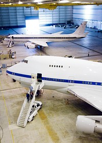 NASA&#39;S SOFIA infrared observatory 747SP (front) and DC-8 flying laboratory (rear) housed at the Dryden Aircraft Operations Facility in Palmdale, Calif, January 17, 2008. Original from NASA. Digitally enhanced by rawpixel.
