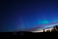 NASA&#39;s BARREL Mission in Sweden. The faint green glow of aurora can be seen above the clouds at Esrange Space Center in this photo from Aug. 23, 2016. Original from NASA. Digitally enhanced by rawpixel.