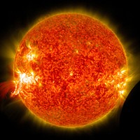 Eruption of a solar flare and a lunar transit captured by NASA's Solar Dynamics Observatory (SDO) on Jan 30th, 2014. Original from NASA. Digitally enhanced by rawpixel.
