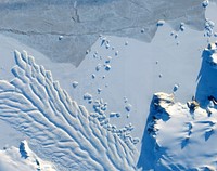 The Matusevich Glacier flows toward the coast of East Antarctica, pushing through a channel between the Lazarev Mountains and the northwestern tip of the Wilson Hills. Original from NASA. Digitally enhanced by rawpixel.