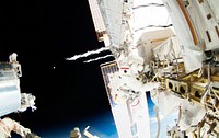 Astronauts working outside the space station&#39;s Quest airlock in Oct 7, 2014. Original from NASA . Digitally enhanced by rawpixel.