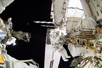 Astronauts working outside the space station&#39;s Quest airlock in Oct 7, 2014. Original from NASA. Digitally enhanced by rawpixel.