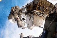 Expedition 51 Commander Peggy Whitson and Flight Engineer Jack Fischer of NASA successfully replaced a large avionics box on Dec 25, 2017. Original from NASA. Digitally enhanced by rawpixel.