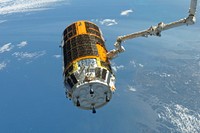 The International Space Station&#39;s Canadarm2 unberths the unpiloted Japan Aerospace Exploration Agency (JAXA) H-II Transfer Vehicle (HTV-3), filled with trash and unneeded items, in preparation for its release from the station. Sept 12th, 2012. Original from NASA . Digitally enhanced by rawpixel.