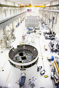 A view from above inside the Operations and Checkout Building high bay at NASA&rsquo;s Kennedy Space Center in Florida, shows the service module for the Orion spacecraft secured to a work stand. Original from NASA . Digitally enhanced by rawpixel.