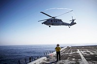 An H60-S helicopter takes off from the deck of the USS Anchorage during the first day of Orion Underway Recovery Test 3 activities in the Pacific Ocean. Original from NASA. Digitally enhanced by rawpixel.