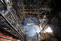 A 250-ton crane is used to lower the second half of the K-level work platforms for NASA&rsquo;s Space Launch System (SLS) rocket into High Bay 3 inside the Vehicle Assembly Building at NASA's Kennedy Space Center in Florida. Original from NASA . Digitally enhanced by rawpixel.