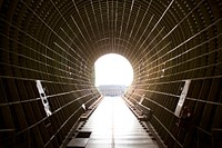 A view from inside the cargo bay of NASA&rsquo;s Super Guppy aircraft reveals that the shipping container with the Orion heat shield for Exploration Mission 1 (EM-1) was offloaded at the Shuttle Landing Facility, managed and operated by Space Florida, at the agency&rsquo;s Kennedy Space Center in Florida. Original from NASA. Digitally enhanced by rawpixel.