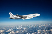 Orbital ATK L-1011 Stargazer aircraft flying over the Atlantic Ocean offshore from Daytona Beach, Florida. December 12, 2016. Original from NASA. Digitally enhanced by rawpixel.