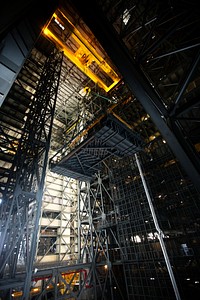 A crane lifts the second half of the B-level work platforms, B north, for NASA's Space Launch System (SLS) rocket. Original from NASA. Digitally enhanced by rawpixel.