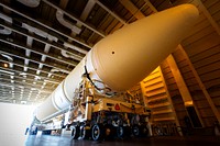 A United Launch Alliance Delta IV Heavy common booster core is about to be offloaded from the company&#39;s Mariner ship at Port Canaveral in Florida. Original from NASA . Digitally enhanced by rawpixel.