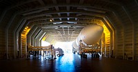 A United Launch Alliance Delta IV Heavy common booster core is about to be offloaded from the company&#39;s Mariner ship at Port Canaveral in Florida. Original from NASA. Digitally enhanced by rawpixel.