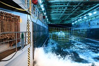 A test article of Orion floats in 6-feet of water in the well deck of the USS Anchorage. Original from NASA. Digitally enhanced by rawpixel.