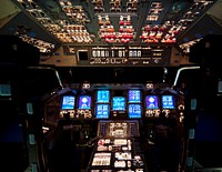 The flight deck of space shuttle Endeavour is illuminated during Space Shuttle Program transition and retirement activities. Original from NASA . Digitally enhanced by rawpixel.