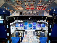 The flight deck of space shuttle Endeavour is illuminated during Space Shuttle Program transition and retirement activities. Original from NASA . Digitally enhanced by rawpixel.