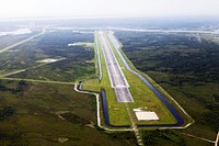 This aerial view shows the 15,000-foot long Shuttle Landing Facility at the Kennedy Space Center, Fla. Original from NASA. Digitally enhanced by rawpixel.