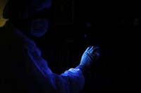 At the Astrotech payload processing facility near NASA's Kennedy Space Center in Florida, a technician performs a black light inspection on one of the Radiation Belt Storm Probes. Original from NASA. Digitally enhanced by rawpixel.