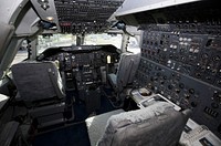 An overview of the cockpit of NASA&#39;s Shuttle Carrier Aircraft, or SCA at the Shuttle Landing Facility at NASA&#39;s Kennedy Space Center in Florida. Original from NASA . Digitally enhanced by rawpixel.