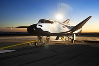 The Sierra Nevada Corporation, or SNC, Dream Chaser flight vehicle is prepared for 60 mile per hour tow tests on taxi and runways at NASA's Dryden Flight Research Center at Edwards Air Force Base in California. Aug 2nd, 2013. Original from NASA . Digitally enhanced by rawpixel.