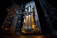 The launch gantry is rolled back to reveal NASA's Orion spacecraft mounted atop a United Launch Alliance Delta IV Heavy rocket at Cape Canaveral Air Force Station's Space Launch Complex 37. Original from NASA. Digitally enhanced by rawpixel.