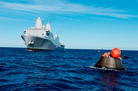 NASA&#39;s Orion spacecraft floats in the Pacific Ocean after splashdown from its first flight test in Earth orbit. Original from NASA. Digitally enhanced by rawpixel.